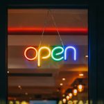 red and white open neon signage