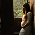 maternity benefits pregnant woman holding her womb