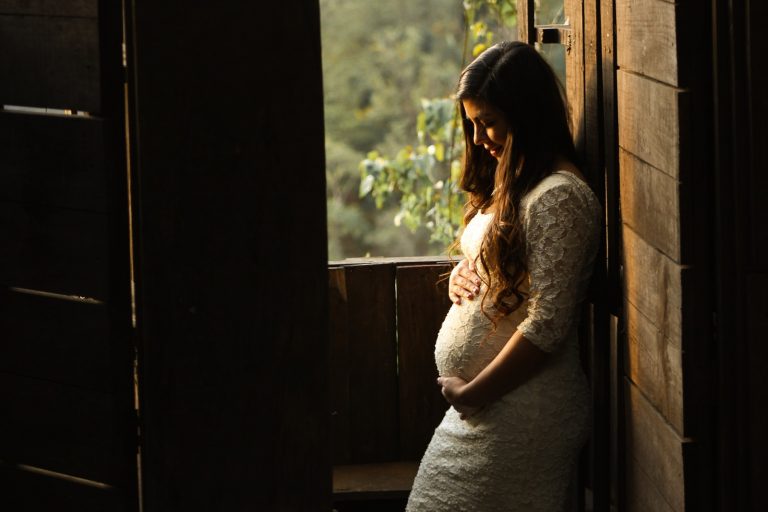 maternity benefits pregnant woman holding her womb