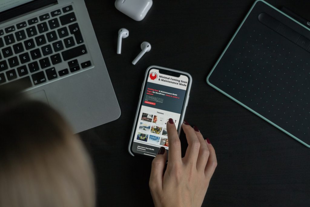 Mobile Phones person holding white samsung android smartphone