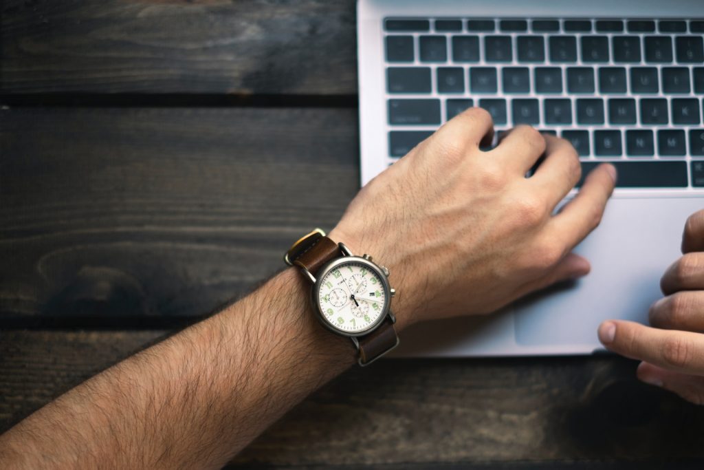 Time Management person wearing brown and white watch