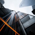 low-angle photo of high-rise buildings under white sky