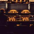 man playing arcade machine