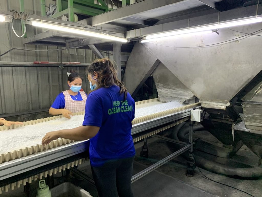 A recycling project partner in the Philippines processes plastic bottles into flakes that other companies can use in new products.  