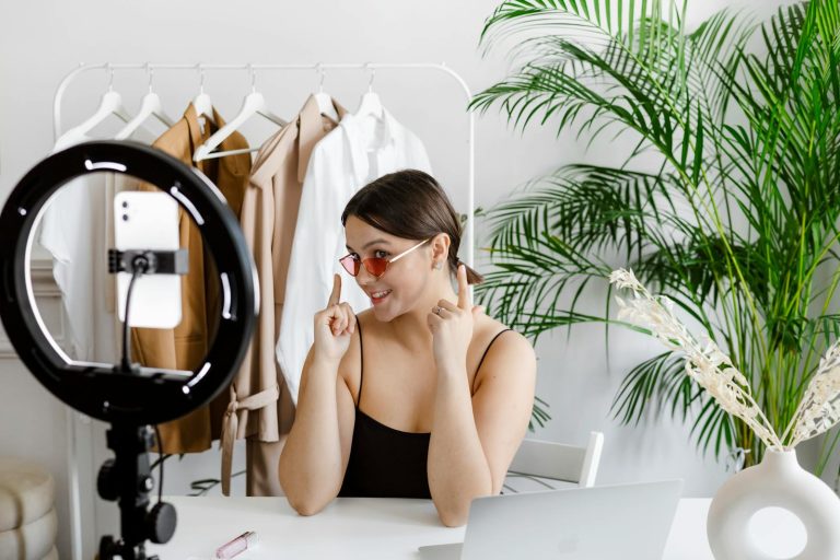 make money on YouTube -A Woman Showing Her Sunglasses to a Video Recording